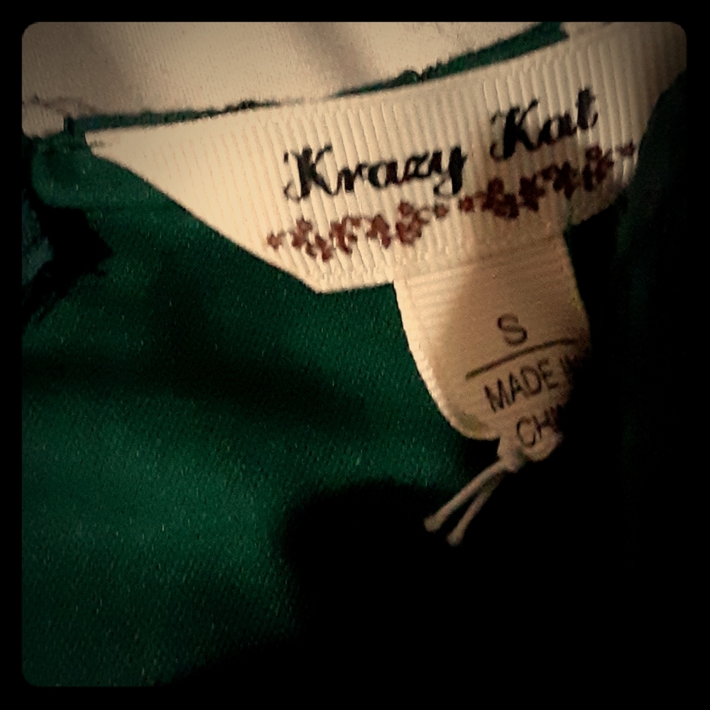 A lacy emerald green dress ,hits midthigh
